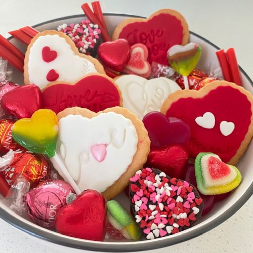 Valentine's cookies, chocolate and lollies in a Valentine's Day gift box.