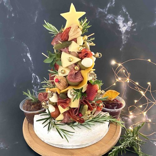 Our Antipasto Christmas Tree has charcuterie and cheese piled high in the shape of a Christmas tree.