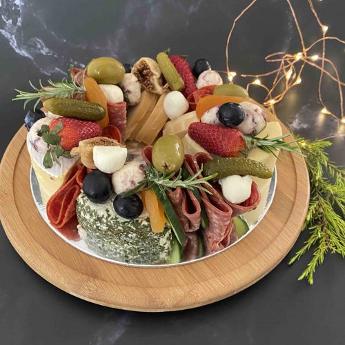 Luxury cheese wreath created with assorted cheese in the shape of a Christmas wreath.
